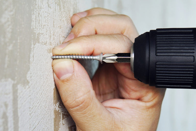 How to Get a Stripped Screw Out of the Wall Drywall by Local Builders